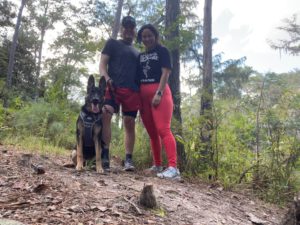 Desiree with husband and dog on a hike